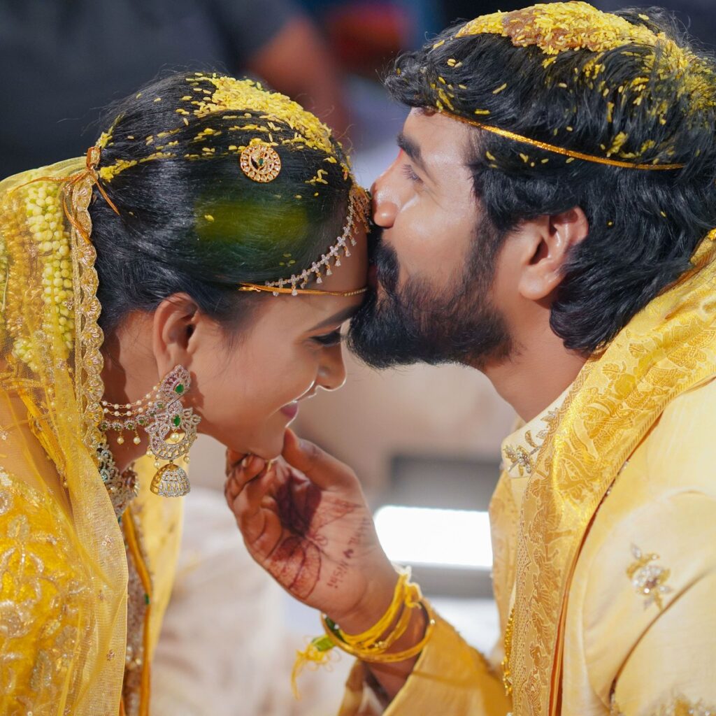 Nishitha and Akhil during their wedding rituals surrounded by family and traditions, photographed by PixelMatrix Photography.