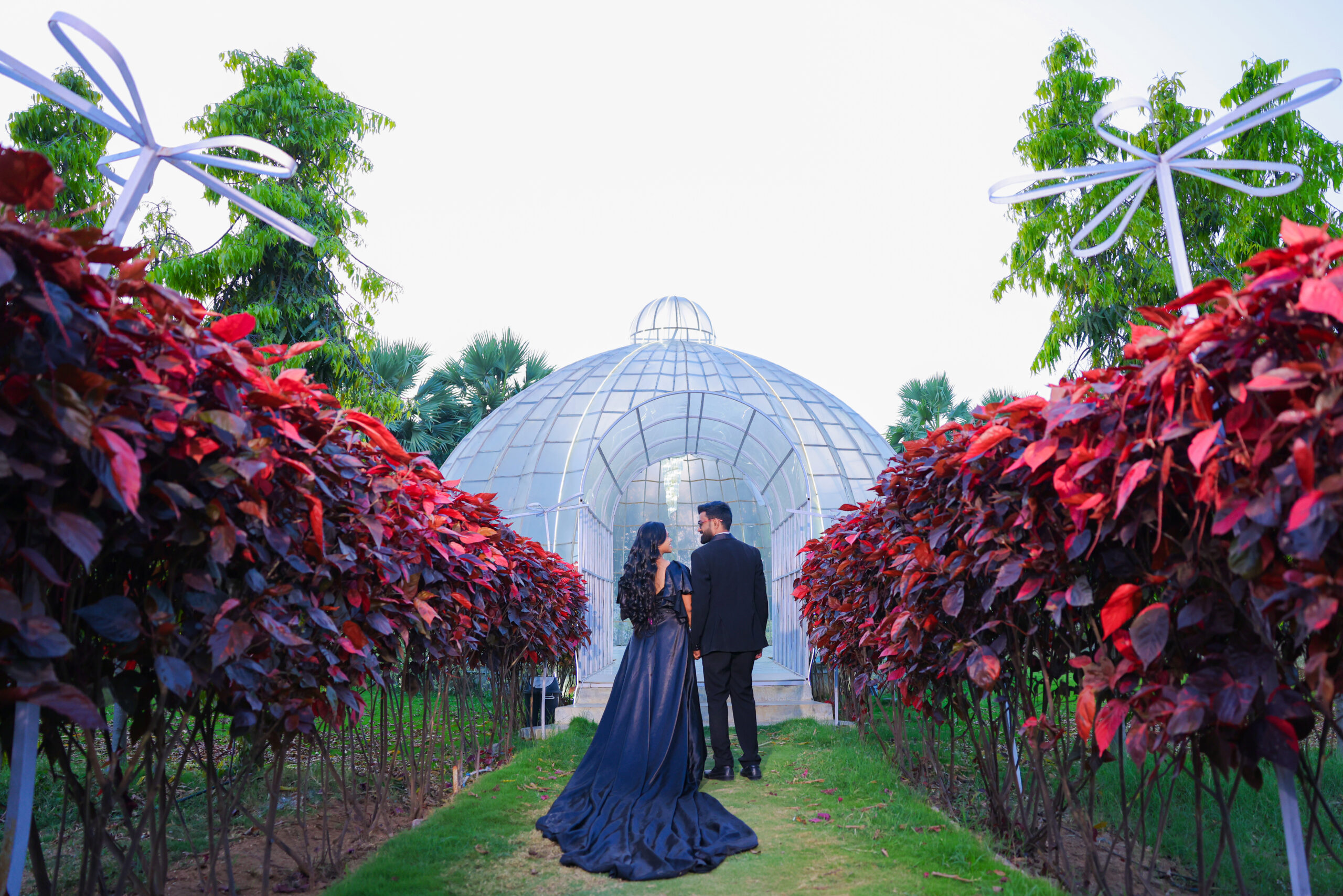 Romantic couple pre wedding shoot banner featuring top Hyderabad locations like Golconda Fort, Charminar, and Taj Falaknuma Palace at sunset.